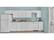 Bright kitchen features white appliances, cabinets, and ample counter space at 619 Somerset Loop, Auburndale, FL 33823