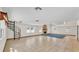 Spacious living room with tile flooring, stone fireplace, and spiral staircase at 619 Somerset Loop, Auburndale, FL 33823