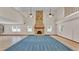 Spacious living room with soaring ceilings, tile flooring, and stone fireplace at 619 Somerset Loop, Auburndale, FL 33823