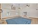 Open-concept living room featuring tile flooring and double doors leading to another room at 619 Somerset Loop, Auburndale, FL 33823