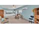 Bright living area with a ceiling fan, white cabinets, a window and natural light at 619 Somerset Loop, Auburndale, FL 33823