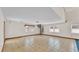 Large living room with tile flooring, spiral staircase, and multiple windows at 619 Somerset Loop, Auburndale, FL 33823