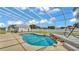 Screened kidney-shaped pool features waterfall, pool deck and spacious backyard at 619 Somerset Loop, Auburndale, FL 33823