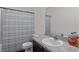 Well-maintained bathroom featuring a granite vanity, neutral paint, and a shower-tub combo at 647 Chicago Way, Dundee, FL 33838