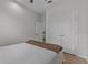 Clean bedroom features a neutral color palette, a ceiling fan, and light colored wood flooring at 647 Chicago Way, Dundee, FL 33838
