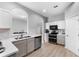Bright kitchen featuring stainless steel appliances and eat-in bar area at 647 Chicago Way, Dundee, FL 33838