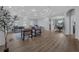Open living room featuring view of the dining room and modern decor at 647 Chicago Way, Dundee, FL 33838