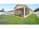 Spacious backyard features a screened porch, garden bed and above-ground pool at 6819 Glenbrook Dr, Lakeland, FL 33811