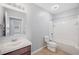 Bathroom featuring a tub with shower, vanity, toilet, and neutral finishes at 6819 Glenbrook Dr, Lakeland, FL 33811