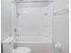 Bright bathroom featuring tub and shower combination and toilet at 6819 Glenbrook Dr, Lakeland, FL 33811