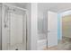 A bathroom features a shower, a tub, and connects to the walk-in closet at 6819 Glenbrook Dr, Lakeland, FL 33811