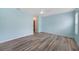 A bedroom features wood flooring, natural light, and a ceiling fan at 6819 Glenbrook Dr, Lakeland, FL 33811