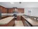 Spacious kitchen features stainless steel appliances, wood cabinets, and ample counter space at 6819 Glenbrook Dr, Lakeland, FL 33811