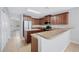 Well-equipped kitchen with stainless steel appliances, abundant cabinetry, and a breakfast bar at 6819 Glenbrook Dr, Lakeland, FL 33811