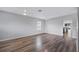 Large living area featuring ceiling fans and an archway leading to the kitchen at 6819 Glenbrook Dr, Lakeland, FL 33811