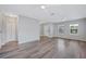 Spacious living room with stylish laminate flooring, bright lighting, and ceiling fans at 6819 Glenbrook Dr, Lakeland, FL 33811