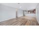 The spacious living room has wood flooring with a kitchen view at 6819 Glenbrook Dr, Lakeland, FL 33811