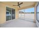 Inviting screened porch features a ceiling fan and a sliding glass door with tranquil views at 6819 Glenbrook Dr, Lakeland, FL 33811