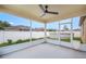 Enjoy outdoor living in this screened porch with ceiling fan, overlooking the backyard and pool at 6819 Glenbrook Dr, Lakeland, FL 33811