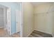 A walk-in closet features wood floors and wire shelving at 6819 Glenbrook Dr, Lakeland, FL 33811