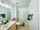 Well-lit bathroom with a vanity, toilet, and a shower-tub combo at 709 N Polk Ave, Fort Meade, FL 33841