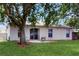 Spacious backyard features a patio and lush grass, perfect for outdoor relaxation at 7337 Hunters Greene Cir, Lakeland, FL 33810