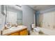 Bathroom features a vanity, toilet and shower with tub at 7337 Hunters Greene Cir, Lakeland, FL 33810
