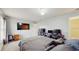 Bright bedroom features a bed, tv and desk, great for work or relaxation at 7337 Hunters Greene Cir, Lakeland, FL 33810