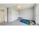 Bedroom offers a ceiling fan, natural light and closet for storage at 7337 Hunters Greene Cir, Lakeland, FL 33810