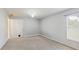 This bedroom offers neutral decor, a ceiling fan and a convenient door with a pet door at 7337 Hunters Greene Cir, Lakeland, FL 33810