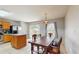 Inviting dining area features a dark wood dining table, stainless steel appliances, tile flooring and ample natural light at 7337 Hunters Greene Cir, Lakeland, FL 33810