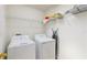 Laundry room boasts washer, dryer, and shelving for easy storage at 7337 Hunters Greene Cir, Lakeland, FL 33810