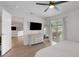 Open Primary bedroom leads to the connected living room with outdoor views through a sliding glass door at 7642 Habersham Dr, Lakeland, FL 33810