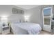Relaxing bedroom with lots of natural light offering blue and white décor at 7642 Habersham Dr, Lakeland, FL 33810