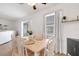 Bright dining area with a wood table, seating for six, and a sliding door leading to the outdoor area at 7642 Habersham Dr, Lakeland, FL 33810