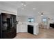Bright kitchen featuring stainless steel appliances, a spacious island, and an adjacent dining area at 7642 Habersham Dr, Lakeland, FL 33810