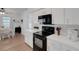 Kitchen with white cabinets, stainless appliances, and a dining area for Gathering meals at 7642 Habersham Dr, Lakeland, FL 33810