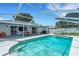 Sparkling screened-in pool and patio offer seamless indoor-outdoor living and backyard enjoyment at 7642 Habersham Dr, Lakeland, FL 33810