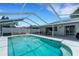 Screened-in pool and patio area with outdoor furniture, perfect for entertaining and relaxation at 7642 Habersham Dr, Lakeland, FL 33810