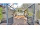 A covered back porch leading to a screened-in pool area, perfect for outdoor living at 841 E Valencia St, Lakeland, FL 33805
