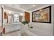 Bright bathroom with a bathtub, white cabinets, and unique decor at 841 E Valencia St, Lakeland, FL 33805