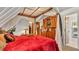 Primary bedroom featuring a four poster canopy bed and an ensuite bathroom at 841 E Valencia St, Lakeland, FL 33805