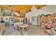 Bright open floor plan with custom wood ceiling, chandelier lighting, and ample space for storage at 841 E Valencia St, Lakeland, FL 33805