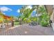 Spacious wood deck featuring outdoor dining and lush landscaping, perfect for enjoying the backyard oasis at 841 E Valencia St, Lakeland, FL 33805