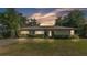 Charming single-story home boasts a well-manicured lawn and tidy landscaping, offering lovely curb appeal at 841 E Valencia St, Lakeland, FL 33805