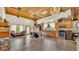 Expansive open floor plan with custom wood ceiling, chandelier lighting, and ample space for entertaining at 841 E Valencia St, Lakeland, FL 33805