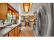 Spacious kitchen featuring stainless steel appliances and wood cabinets at 841 E Valencia St, Lakeland, FL 33805