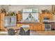 Kitchen area with wood cabinets, modern stainless appliances, and natural lighting at 841 E Valencia St, Lakeland, FL 33805