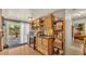 Bright kitchen featuring wooden cabinets, plenty of storage, and natural light at 841 E Valencia St, Lakeland, FL 33805