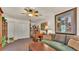 Cozy living area features a comfortable sofa, wooden desk and double closets at 841 E Valencia St, Lakeland, FL 33805